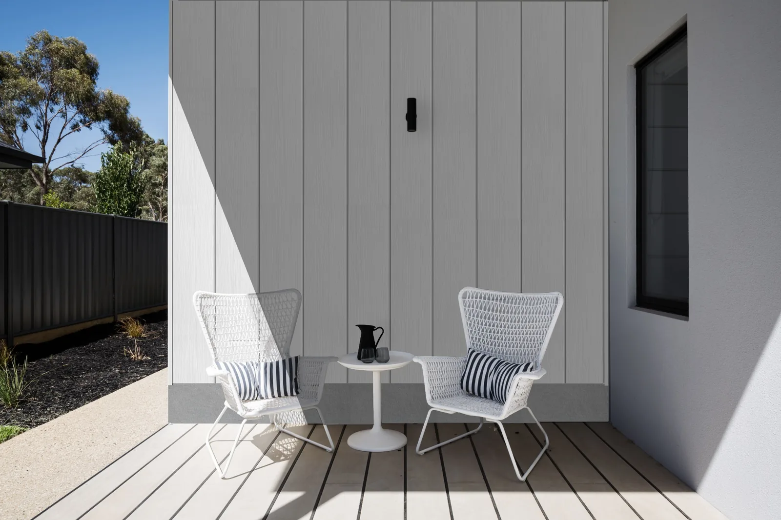 Fortex Clic vertical white cladding on a bright modern wall
